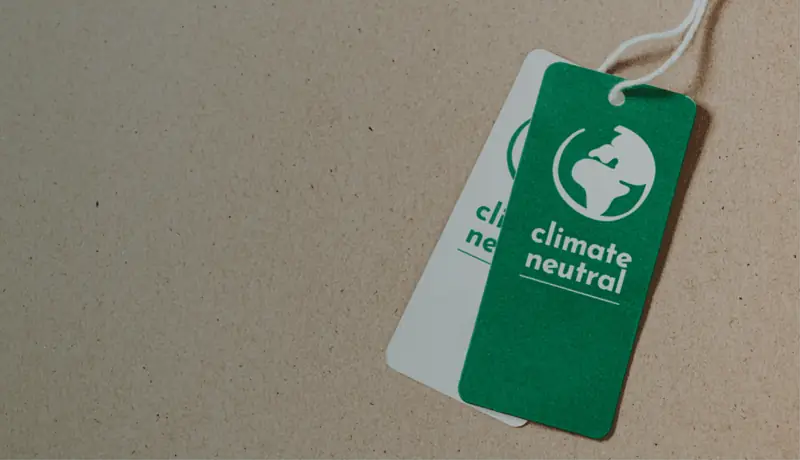 Tag reading climate neutral on a cardboard background